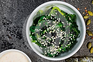 Chuk seaweed salad and sesame seeds. Chinese cuisine.