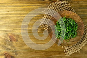 Chukka Seaweed Salad or Sea Kelp Salat on Rustic Background