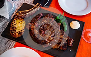 Chuleton is a popular Spanish dish made from a beef steak photo