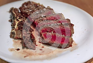 Chuleton, traditional Spanish rib eye steak in a restaurant in Pamplona, Spain photo