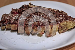 Chuleton, traditional Spanish rib eye steak in a restaurant in Pamplona, Spain photo