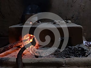 A Chulha or a old day manual stove used for cooking in India. Its still used in villages. Food cooked with this has smoky taste. photo