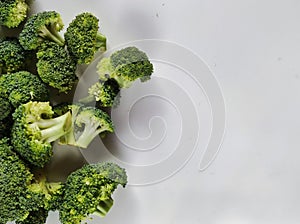 Chunked of broccoli for photography purposes as food background in negative space photo