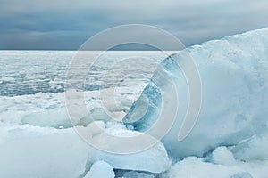 Chunks of ice washed ashore winter sea.