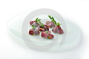 Chunks of rawbluefin tuna in ravigote sauce and parsley