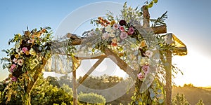 Chuppah with cascading flowers and lace cloth