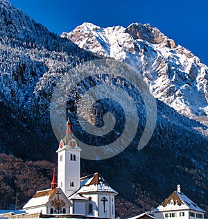 Church with the Alps in the background, Switzerland.