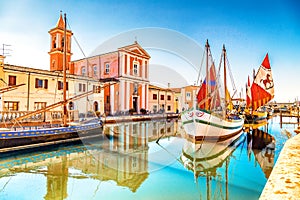 Church and ancient sailboats on Canal Port