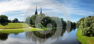 Church in Anyksciai city and river Sventoji