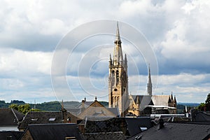 Church of arlon over the roofs of the old town against a cloudy