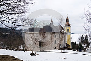 Church of Assumption with glass roof in snowy mountains country, Neratov, Orlicke hory, Eagle Mountains