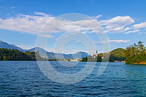 Church of the Assumption of the Virgin Mary on an island near Lake Bled in Slovenia. There are beautiful clouds in the sky