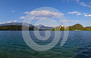 Church of the Assumption of the Virgin Mary on an island near Lake Bled in Slovenia. There are beautiful clouds in the sky
