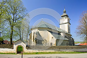 The Church of the Assumption of the Virgin Mary in Lubica with fortication wall