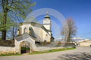 The Church of the Assumption of the Virgin Mary in Lubica with fortication wall