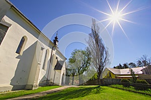 The Church of the Assumption of the Virgin Mary in Lubica with fortication wall