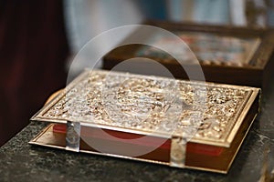 Church attribute a golden Bible with a lock on the altar, gospel, holy