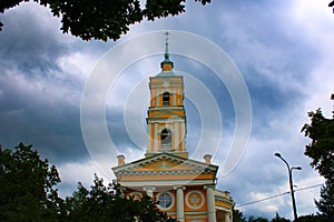 Church on the background of dark rain clouds photo