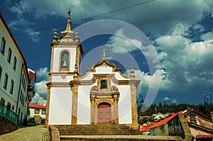 Church in baroque style with steeple and staircase