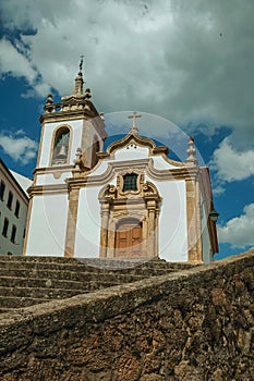 Church in baroque style with steeple and staircase