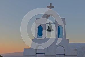 Church bell in oia, Santorini. Sunset. Greece.