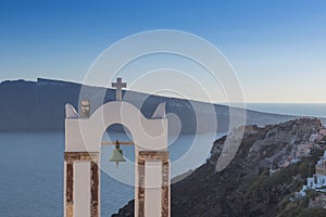 Church bell in oia, Santorini. Sunset. Greece.