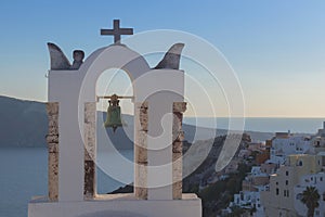 Church bell in oia, Santorini. Sunset. Greece.