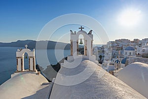 Church bell in oia, Santorini. Sunset. Greece.