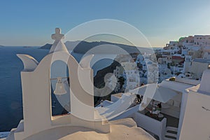 Church bell in oia, Santorini. Sunset. Greece.