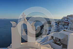 Church bell in oia, Santorini. Sunset. Greece.