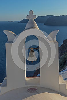 Church bell in oia, Santorini. Sunset. Greece.