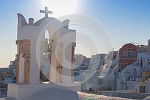 Church bell in oia, Santorini. Sunset. Greece.