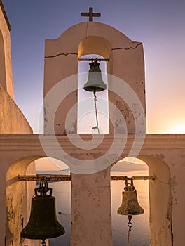 Church Bell Tower at Sunset in Santorini, Greece