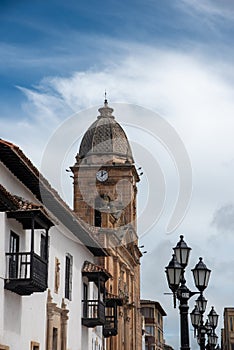 Bell tower with clock of the church in the city of Tunja .BoyacÃÂ¡. Colombia. photo