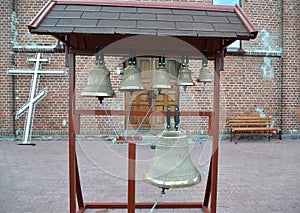 Church bells on a figurative folding belfry