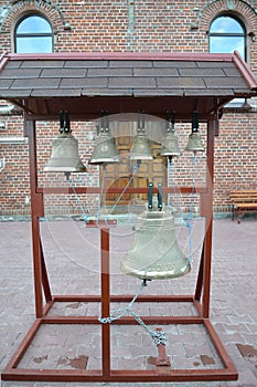 Church bells on a figurative folding belfry