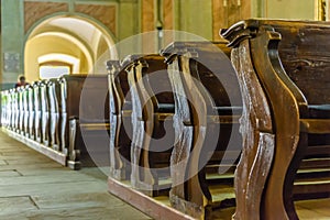 Church benches with little depth on filed