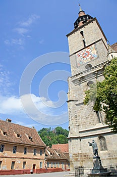 The church Biserica Neagra (The Black Church) situated near the square Piata Sfatului, and the Statue of Johannes Honterus.