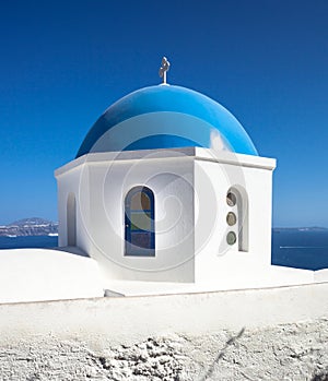 Church with blue cupola at Oia Village, Santorini island.