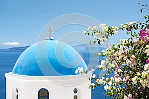 Church With Blue Cupola in Santorini, Greece photo