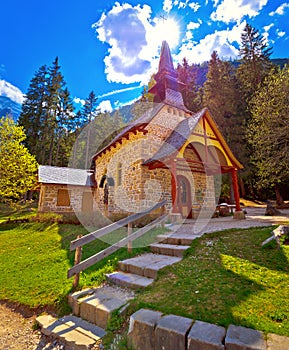 Church and Braies lake in Dolomite Apls