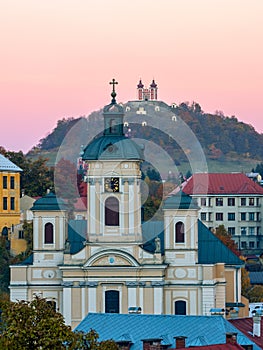 Church with Calvary of Banska Stiavnica at sunset in an autumn