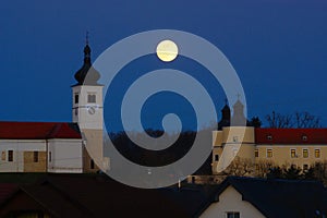 Church and castle at january full moon, Velika Nedelja, Slovenia