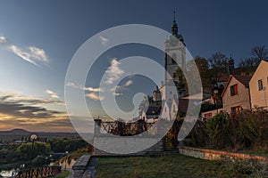 Church castle and old houses in old town Melnik in central Bohemia with sunset