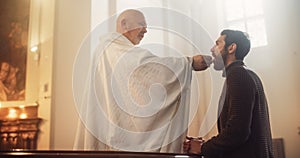 In Church Ceremony of Holy Communion, Eucharist or Last Supper: Christian Minister Breaking bread