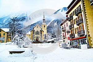 Church in Chamonix town, France, French Alps, part of street and mountains