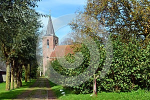 Church with church path in the Groningen village of Eenum