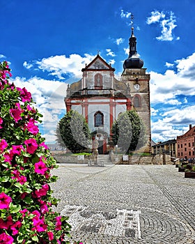 Church in city with clouds