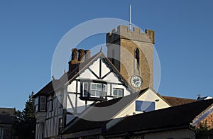 Church clock tower with timber building