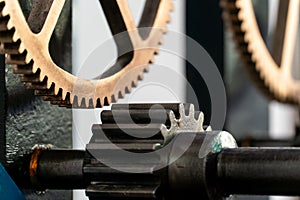 Church clockwork. The gear mechanism of a large old tower clock. Antique large clock mechanism with gears and cogs after